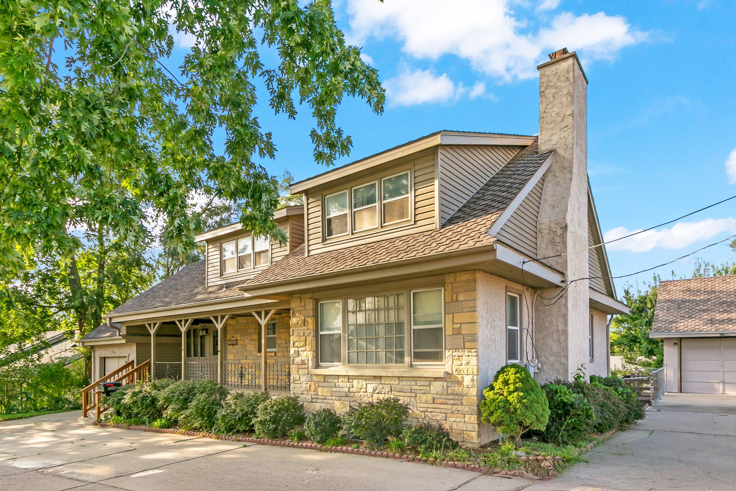 A classic Omaha-area home with a stone porch