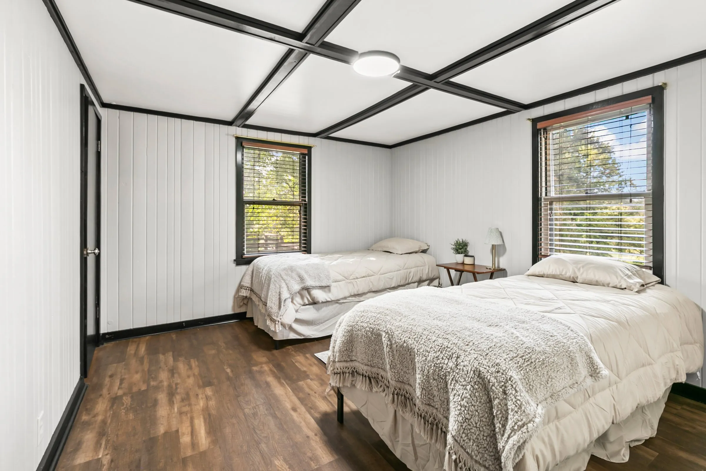 Bedroom with a beamed ceiling