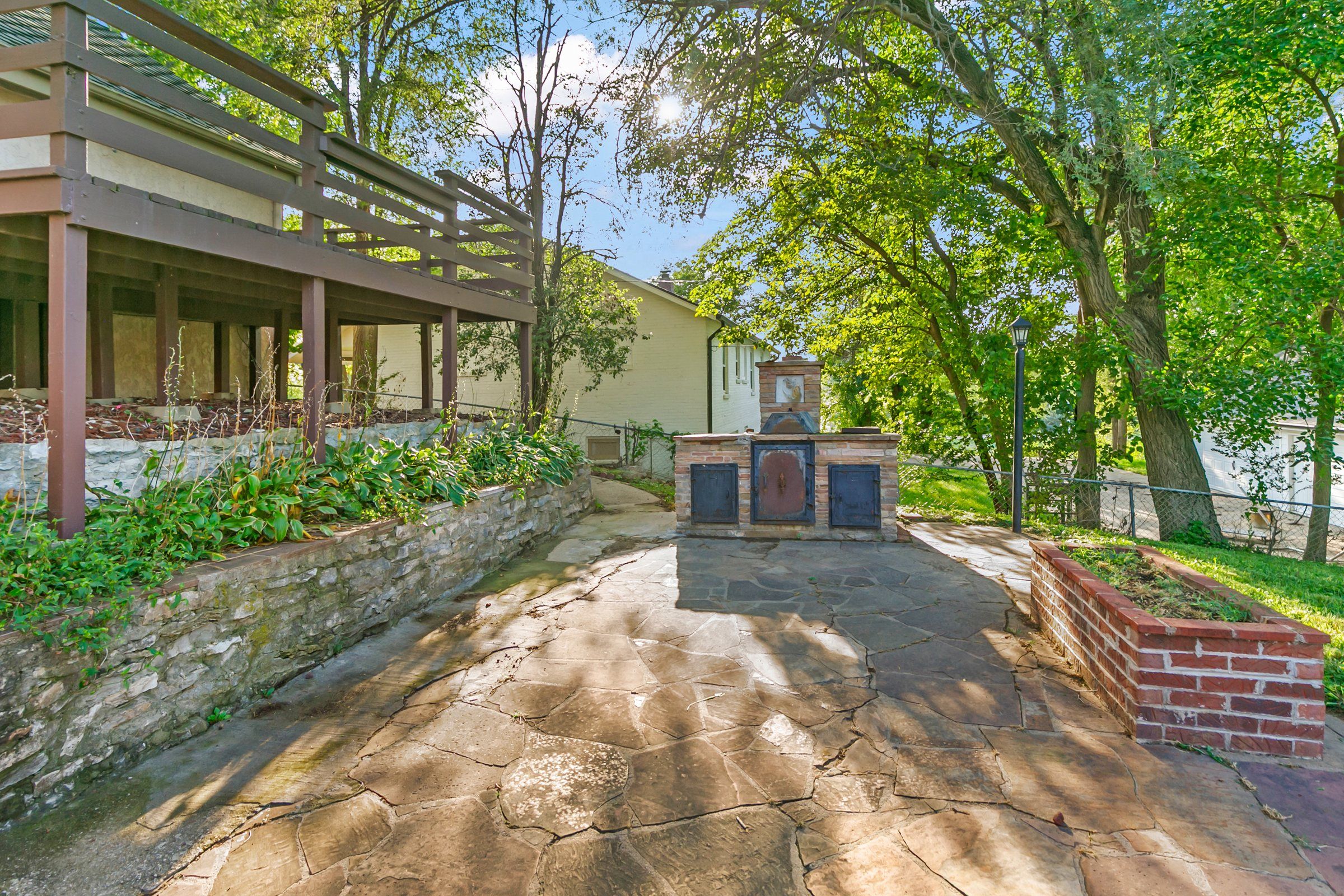 Stone patio with outdoor fireplace