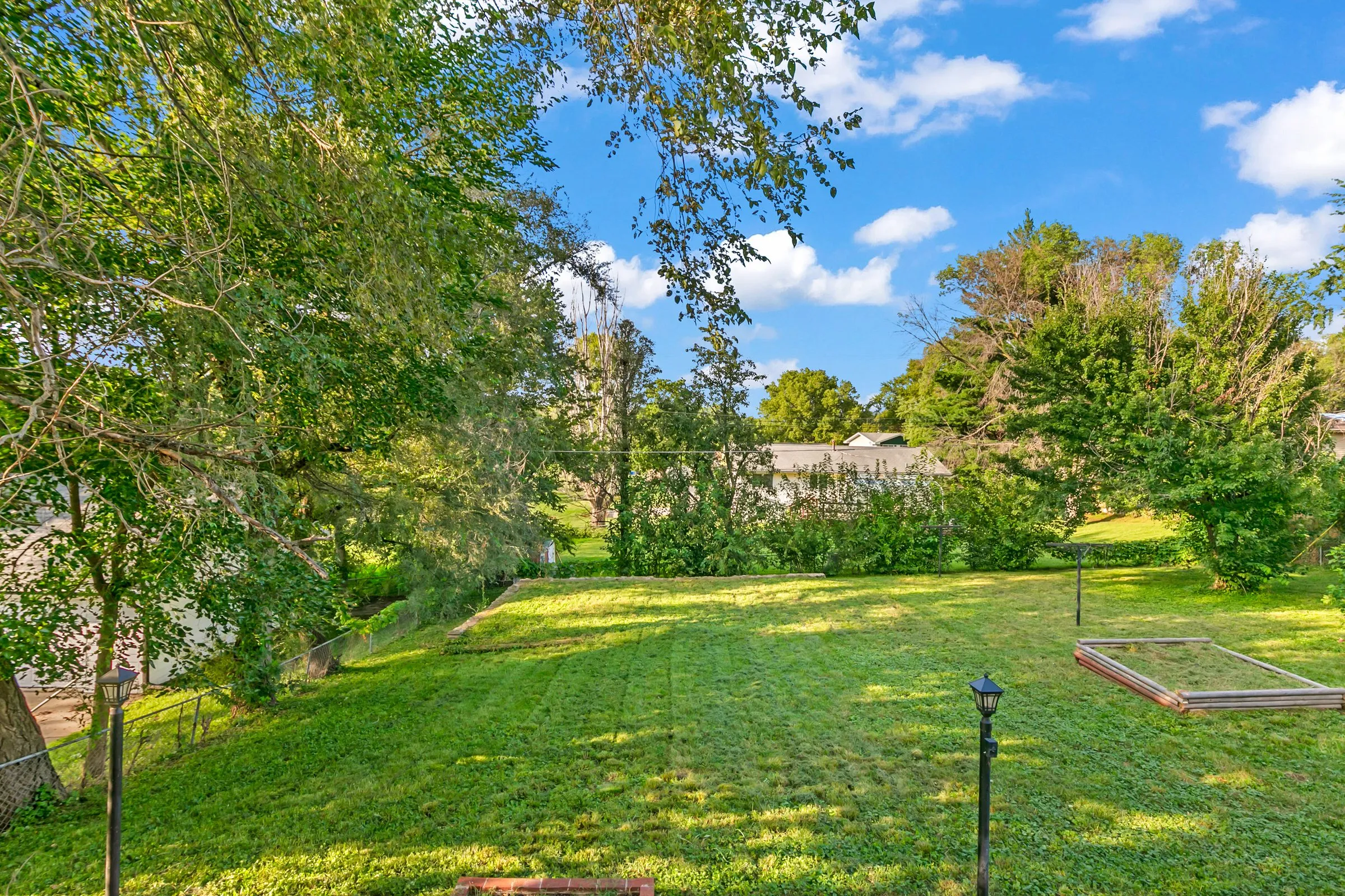 Deep backyard with mature trees